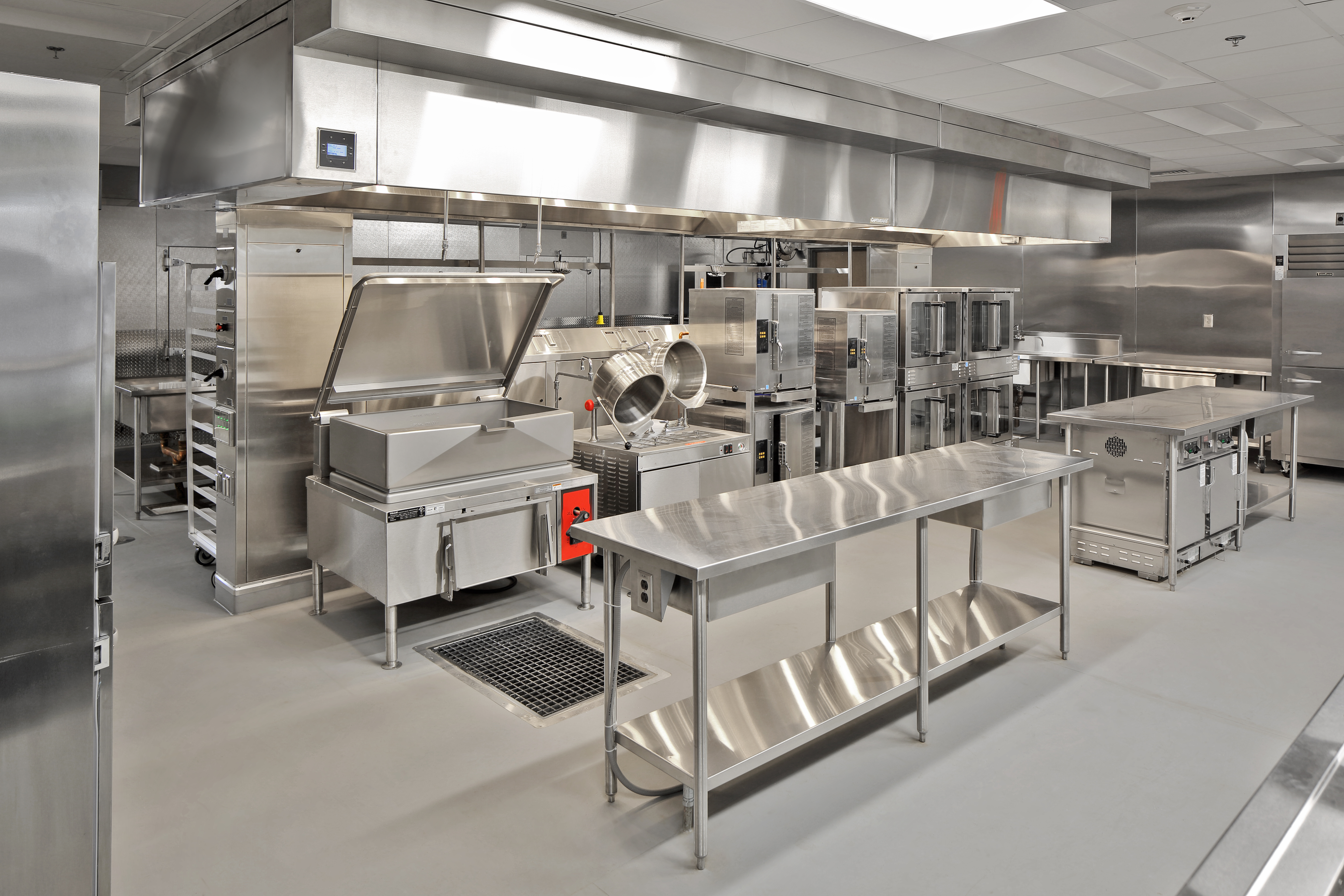 Food Equipment Manufacturer Products Commercial kitchen filled with stainless steel equipment