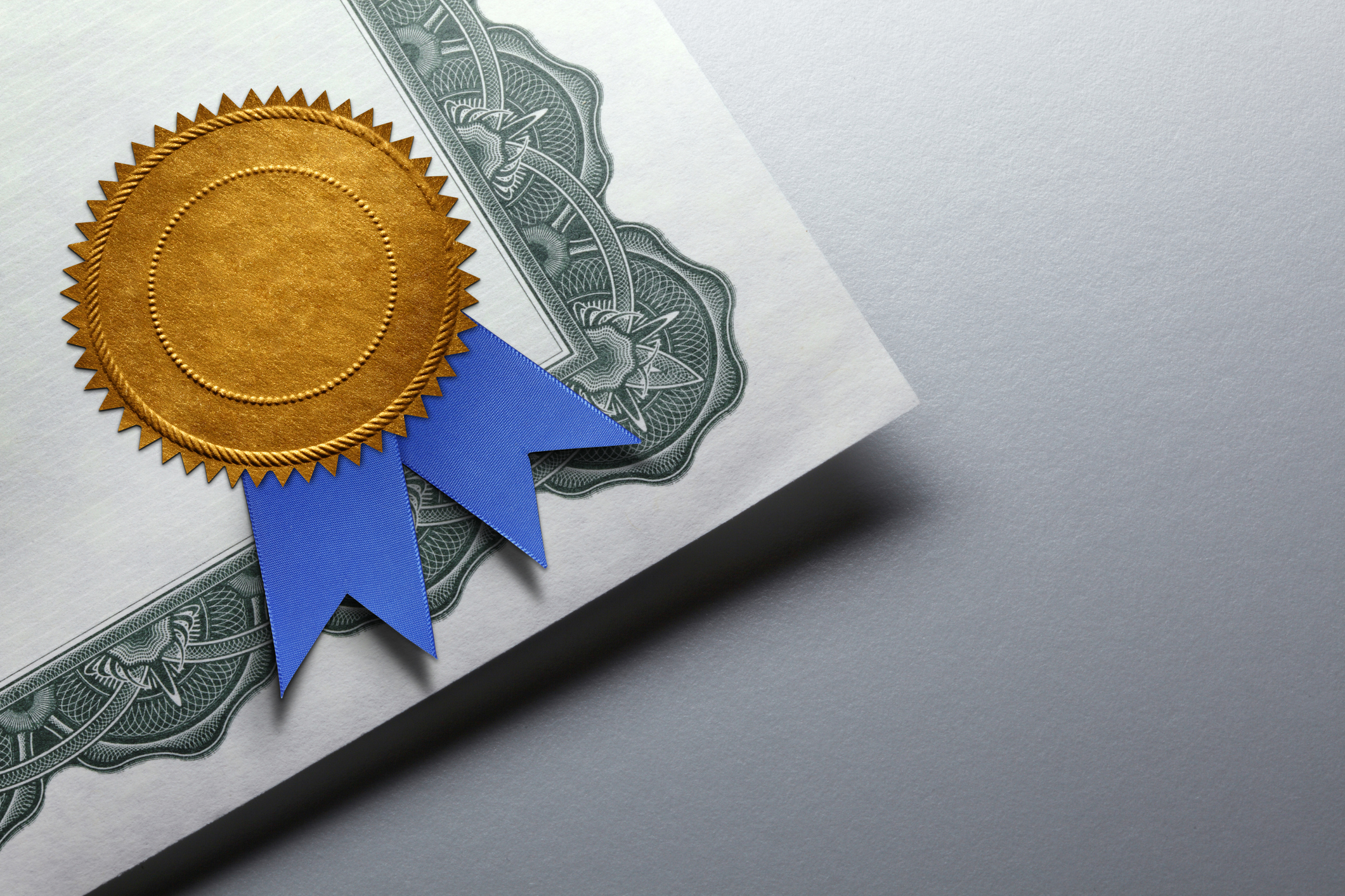 Gold Seal With Blue Ribbon On A Certificate Of Achievement